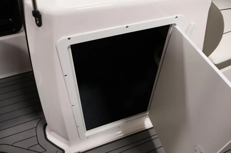 Slide: The Image of Open storage compartment on a 2017 Yamaha Boats 212 Limited S. - 31