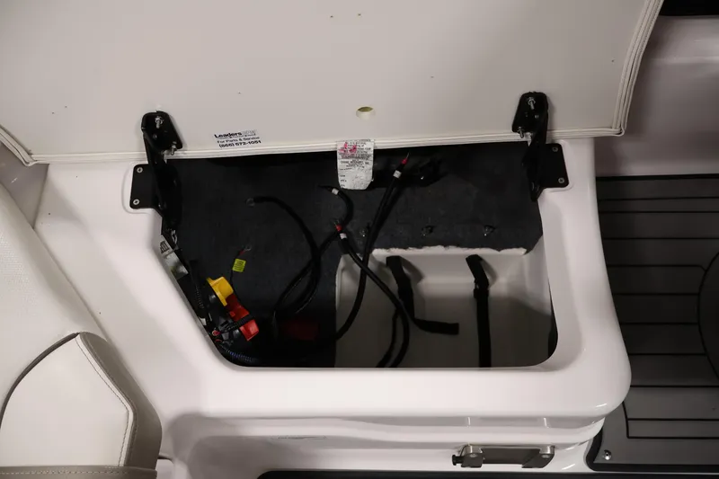 Slide: The Image of Open storage compartment in 2017 Yamaha Boats 212 Limited S, showing wiring and interior details. - 37