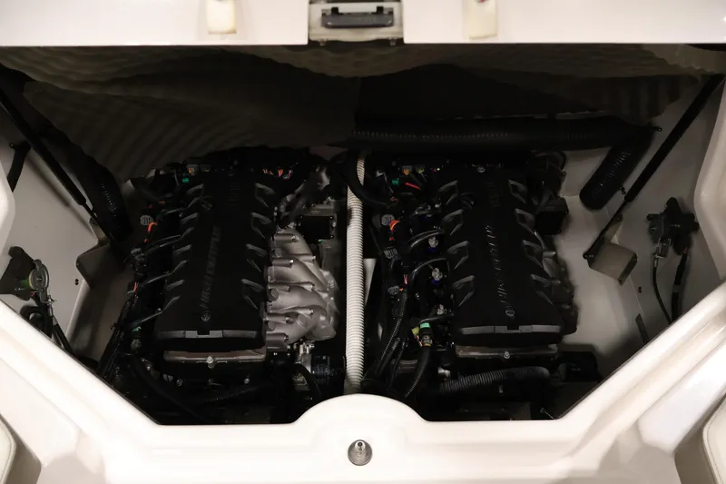 Slide: The Image of Engine compartment of 2017 Yamaha Boats 212 Limited S, showcasing dual engines. - 38