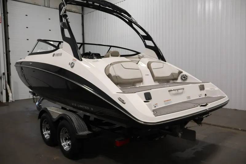 Slide: The Image of 2017 Yamaha Boats 212 Limited S on trailer in indoor storage. - 7