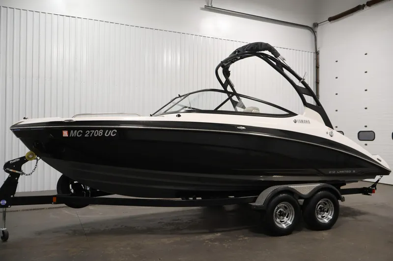 Slide: The Image of 2017 Yamaha Boats 212 Limited S on trailer in indoor setting. - 8