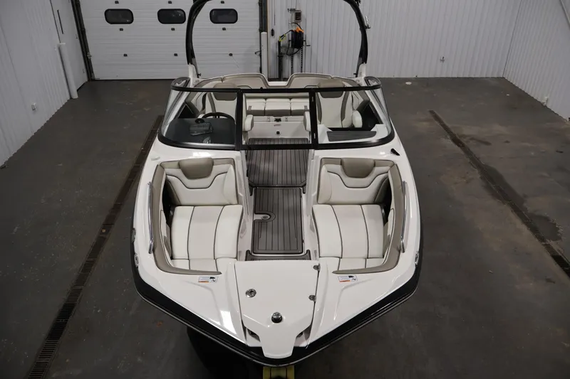 Slide: The Image of 2017 Yamaha Boats 212 Limited S in a garage, showcasing sleek interior design. - 9
