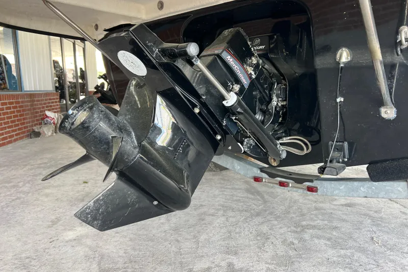 Slide: The Image of 2017 Bayliner 195 Deck Boat with MerCruiser engine, close-up of outdrive and propeller. - 11