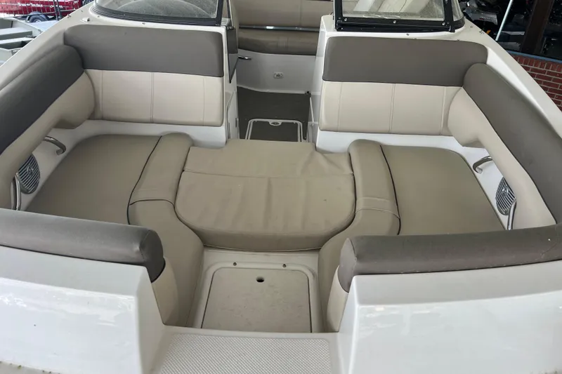 Slide: The Image of 2017 Bayliner 195 Deck Boat interior with beige and gray seating. - 12