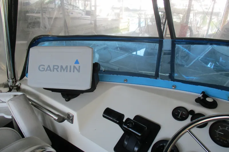 Slide: The Image of Cockpit of 1988 Commander 26 boat with Garmin navigation system. - 3