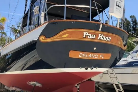 Slide: The Image of 1985 Kadey-Krogen 38 boat named "Pau Hana" in Deland, FL, docked outdoors. - 16