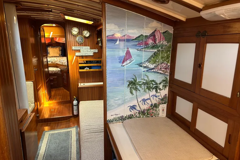 Slide: The Image of Interior of 1985 Kadey-Krogen 38 yacht with nautical decor and wooden finishes. - 3