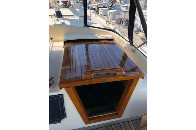 Slide: The Image of 1985 Kadey-Krogen 38 yacht with polished wooden hatch in marina setting. - 4