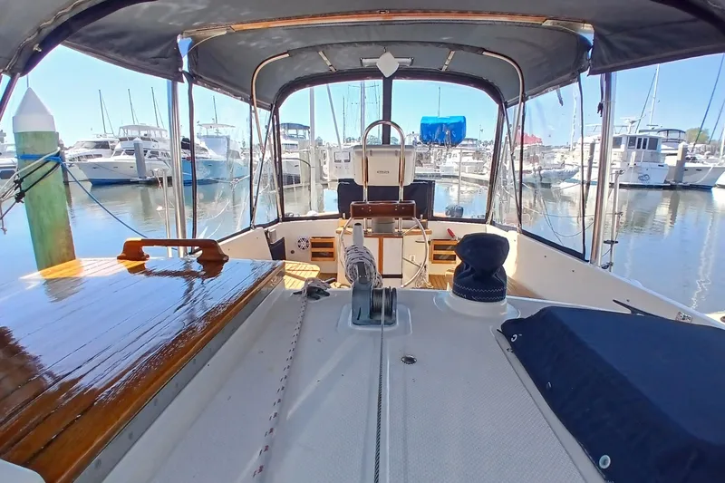 Slide: The Image of Cockpit view of 1985 Kadey-Krogen 38 yacht docked in a marina. - 44