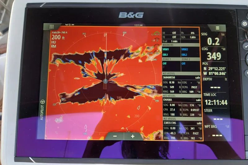 Slide: The Image of B&G marine radar display on a 1985 Kadey-Krogen 38, showing navigation data and vessel position. - 54