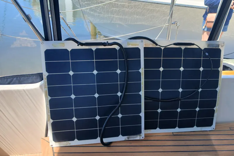 Slide: The Image of Solar panels on a 1985 Kadey-Krogen 38 boat deck, harnessing renewable energy. - 57