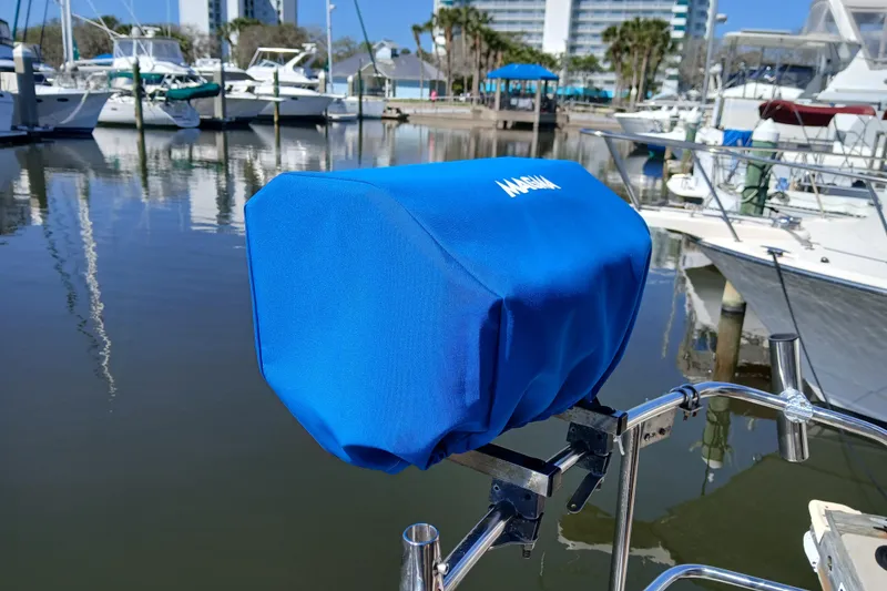 Slide: The Image of Blue cover on a Kadey-Krogen 38 boat accessory, docked in a marina, 1985 model. - 68
