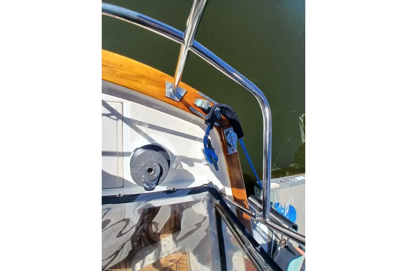 Slide: The Image of 1985 Kadey-Krogen 38 boat deck with railing and nautical equipment. - 73