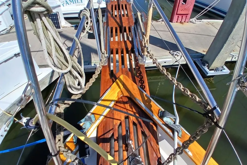 Slide: The Image of Bow of 1985 Kadey-Krogen 38 yacht with wooden deck and ropes at marina. - 80