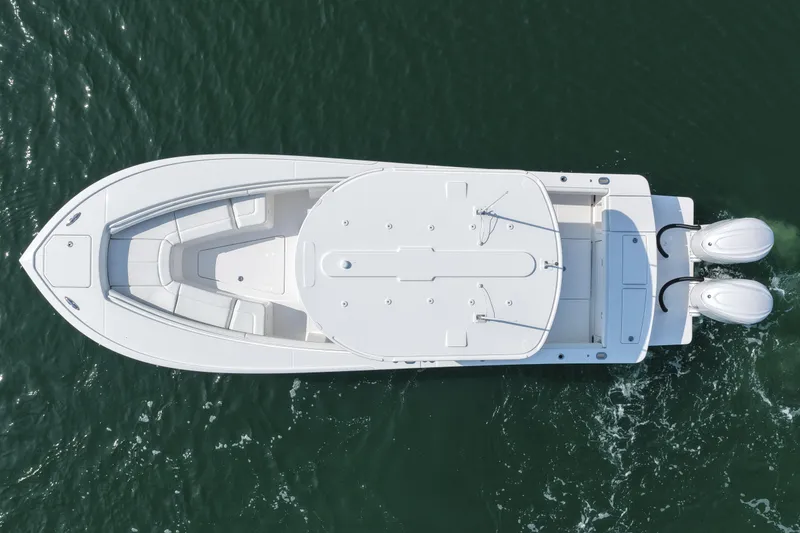 Slide: The Image of Aerial view of 2026 Regulator 28 boat with dual engines on open water. - 16