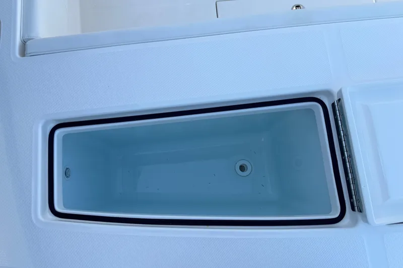Slide: The Image of 2026 Regulator 28 boat storage compartment, open and empty. - 20