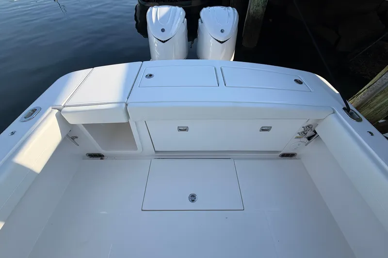 Slide: The Image of 2026 Regulator 28 boat deck with dual engines and storage compartments. - 23