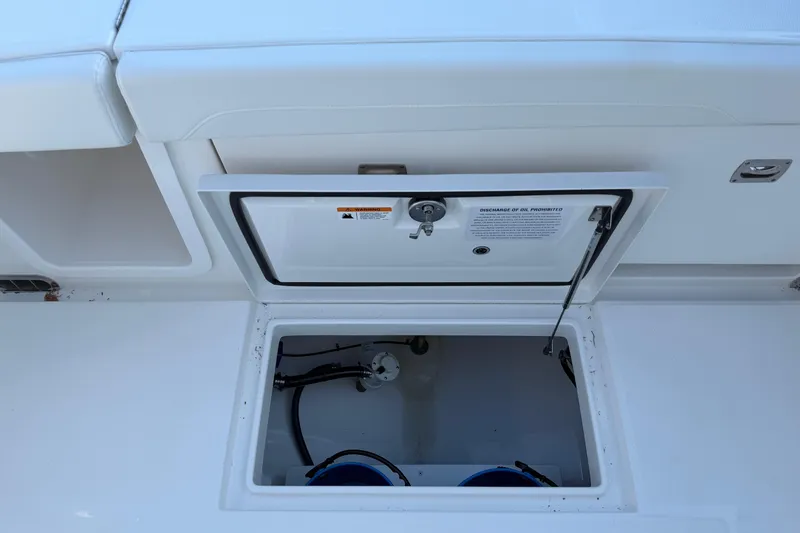 Slide: The Image of Open storage compartment on a 2026 Regulator 28 boat, showcasing interior details. - 25