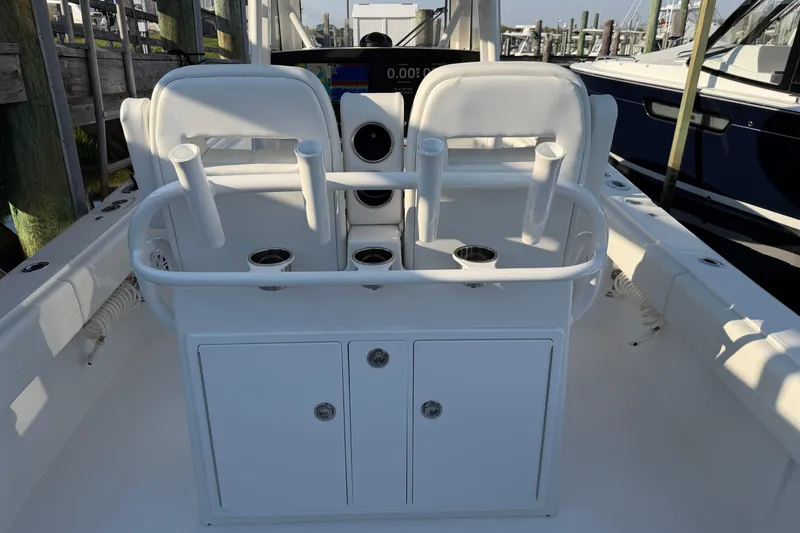 Slide: The Image of 2026 Regulator 28 boat interior with rod holders and storage compartments. - 29