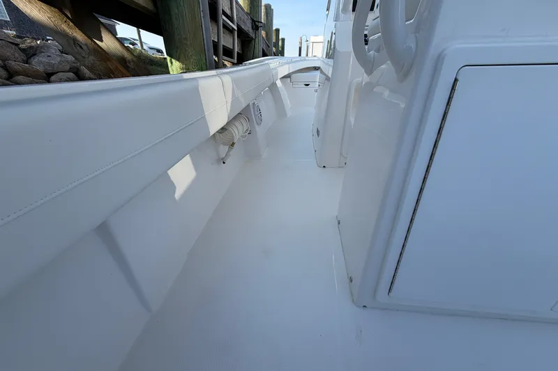 Slide: The Image of 2026 Regulator 28 boat interior, showcasing sleek white deck and side panel design. - 33