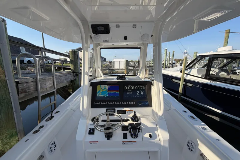Slide: The Image of Interior view of a 2026 Regulator 28 boat with advanced navigation system. - 34