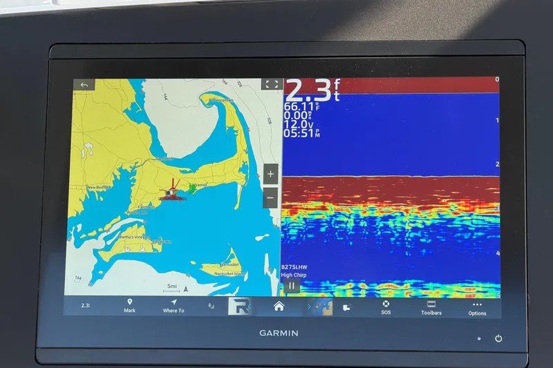 Slide: The Image of Garmin marine display showing navigation map and sonar data on a Regulator 28, 2026 model. - 37