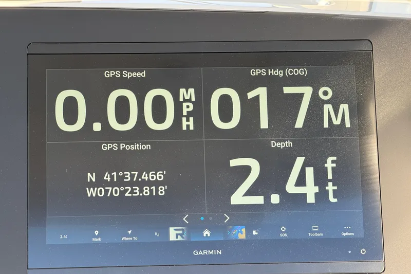 Slide: The Image of Garmin GPS display on Regulator 28 boat, showing speed, heading, position, and depth. - 38