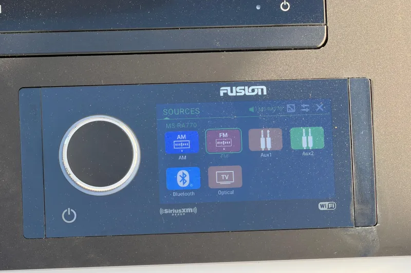Slide: The Image of Fusion MS-RA770 audio system interface on 2026 Regulator 28 boat dashboard. - 39