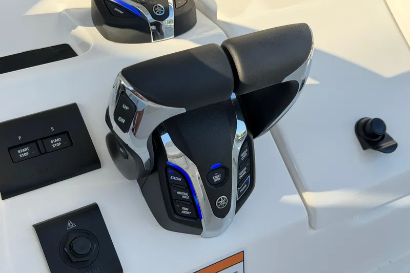Slide: The Image of Throttle controls on a 2026 Regulator 28 boat dashboard, featuring Yamaha branding. - 43