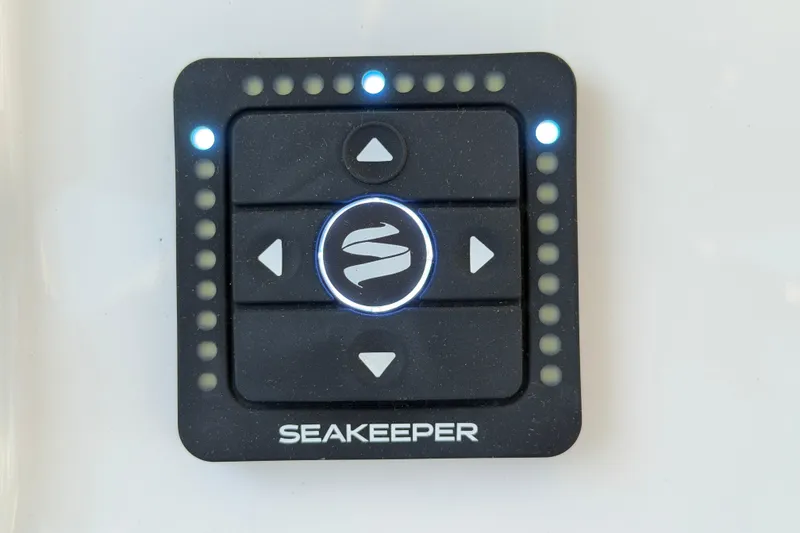 Slide: The Image of Seakeeper control panel on 2026 Regulator 28 boat, featuring illuminated buttons. - 44