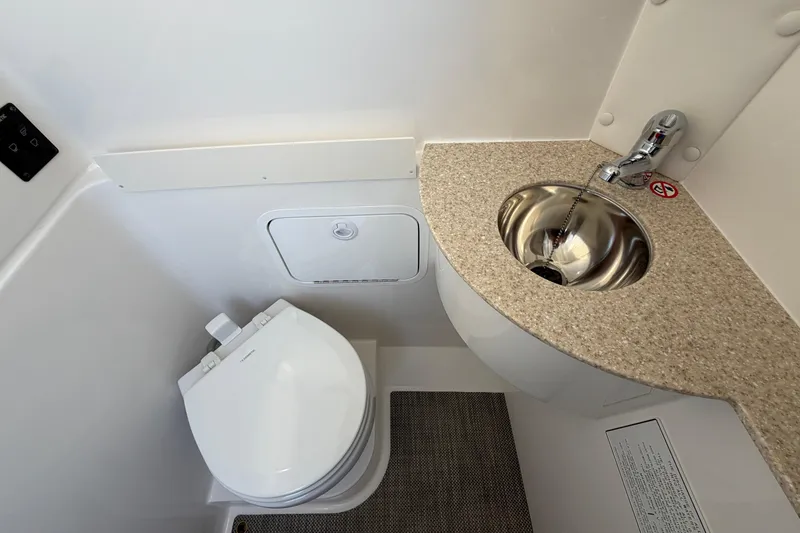 Slide: The Image of 2026 Regulator 28 boat bathroom with modern sink and toilet design. - 65