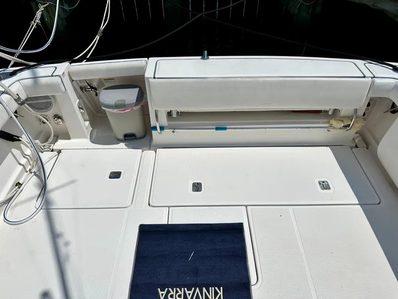 Slide: The Image of 2004 Tiara Yachts 3200 Open deck with storage compartments and seating area. - 15