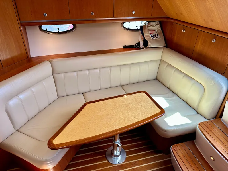 Slide: The Image of Luxurious interior of 2004 Tiara Yachts 3200 Open with plush seating and wooden accents. - 20
