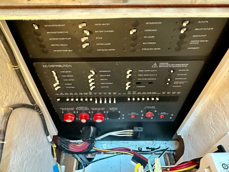 Slide: The Image of Electrical panel of a 2004 Tiara Yachts 3200 Open, showing switches and wiring. - 21