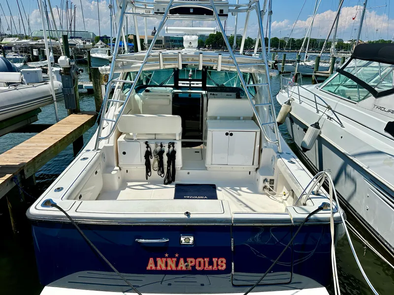 Slide: The Image of 2004 Tiara Yachts 3200 Open docked at marina, rear view. - 4