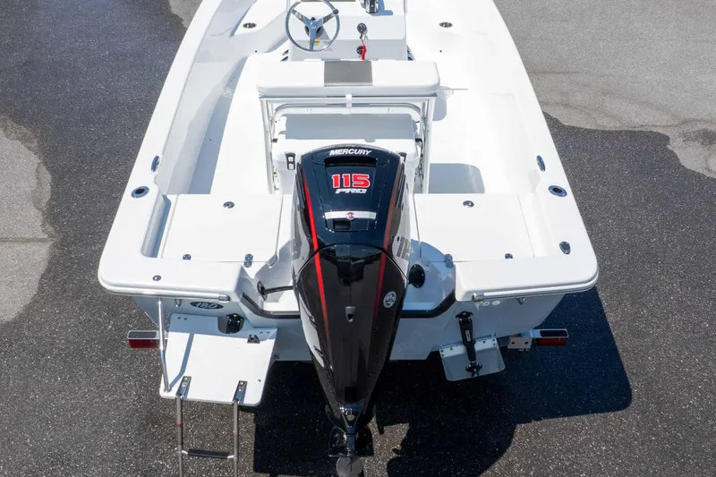 Slide: The Image of 2026 Frontier 180 boat with Mercury 115 outboard motor, rear view on pavement. - 14