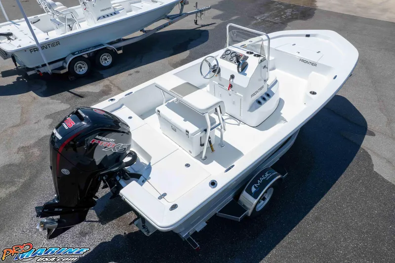 Slide: The Image of 2026 Frontier 180 boat with Mercury engine, displayed on a trailer in a marina. - 17