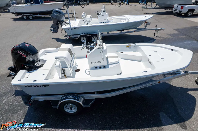Slide: The Image of 2026 Frontier 180 boat on trailer, featuring sleek design and powerful outboard motor. - 18