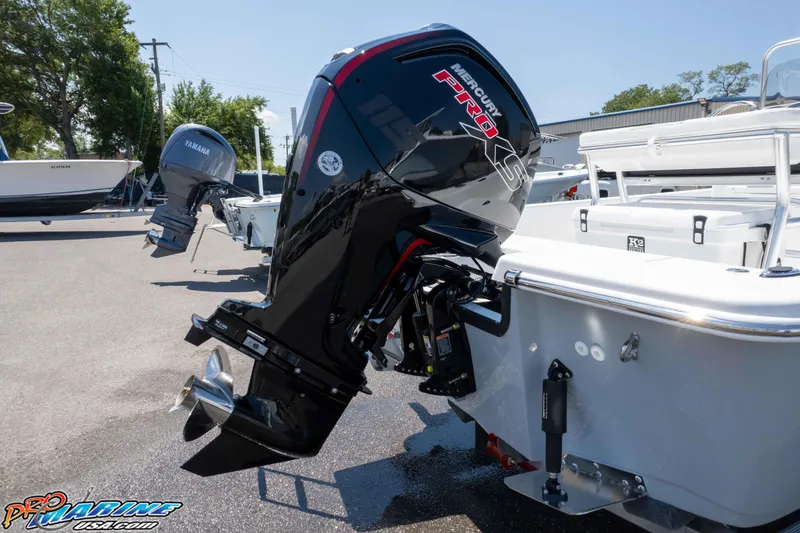Slide: The Image of Outboard motor on a Frontier 180 boat, 2026 model, in a marina setting. - 20