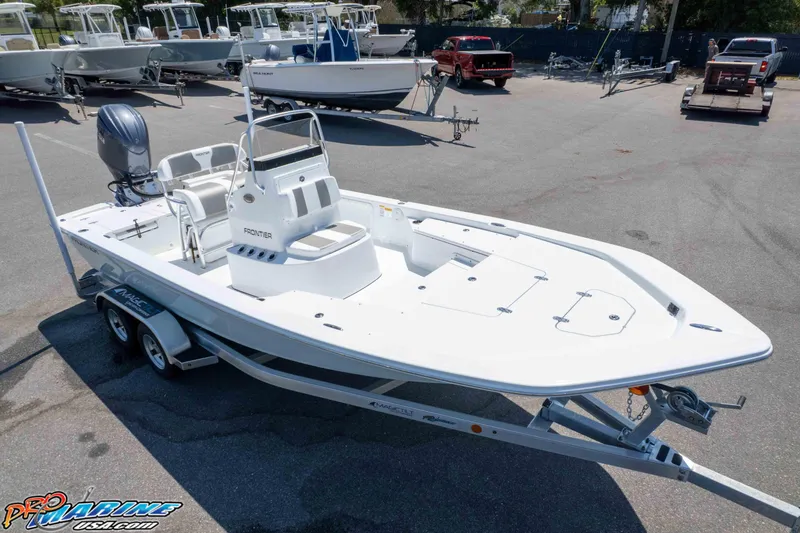 Slide: The Image of 2026 Frontier 180 boat on trailer in marina parking lot. - 24