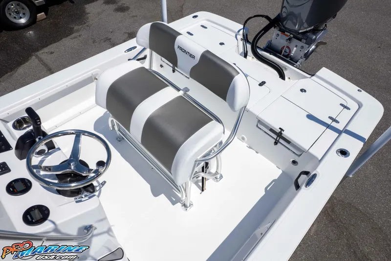 Slide: The Image of 2026 Frontier 180 boat interior with dual seats, steering wheel, and motor controls. - 28