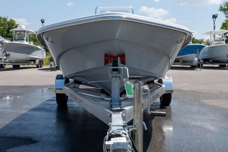 Slide: The Image of Front view of a 2026 Frontier 180 boat on a trailer in a parking lot. - 4