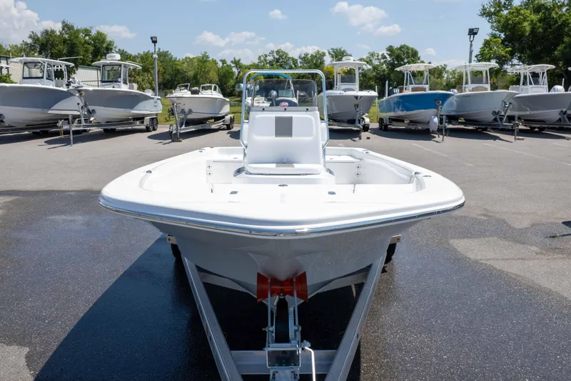 Slide: The Image of 2026 Frontier 180 boat on trailer, surrounded by other boats in a sunny outdoor setting. - 5