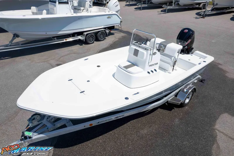 Slide: The Image of 2026 Frontier 180 boat on trailer in marina parking lot. - 9