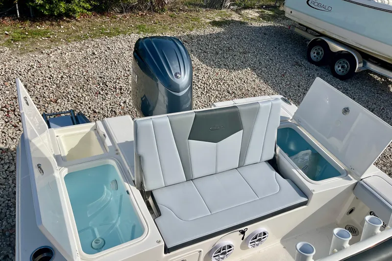 Slide: The Image of 2026 Robalo 226 Cayman boat interior with seating and storage compartments. - 10