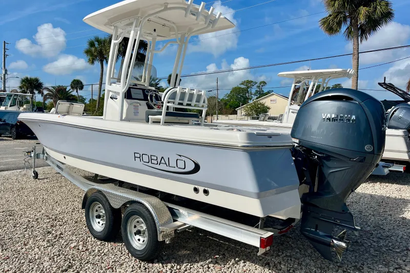 Slide: The Image of 2026 Robalo 226 Cayman boat with Yamaha engine on trailer, outdoor display. - 8
