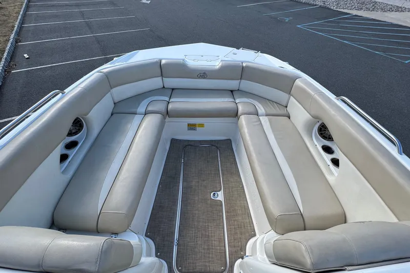 Slide: The Image of 2017 NauticStar 243DC Sport Deck boat interior with spacious seating and cup holders. - 19