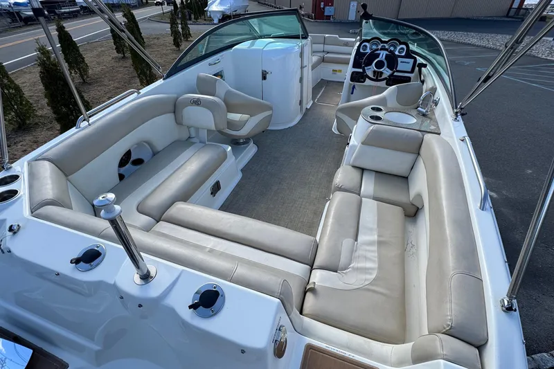 Slide: The Image of 2017 NauticStar 243DC Sport Deck boat interior with spacious seating and modern dashboard. - 2