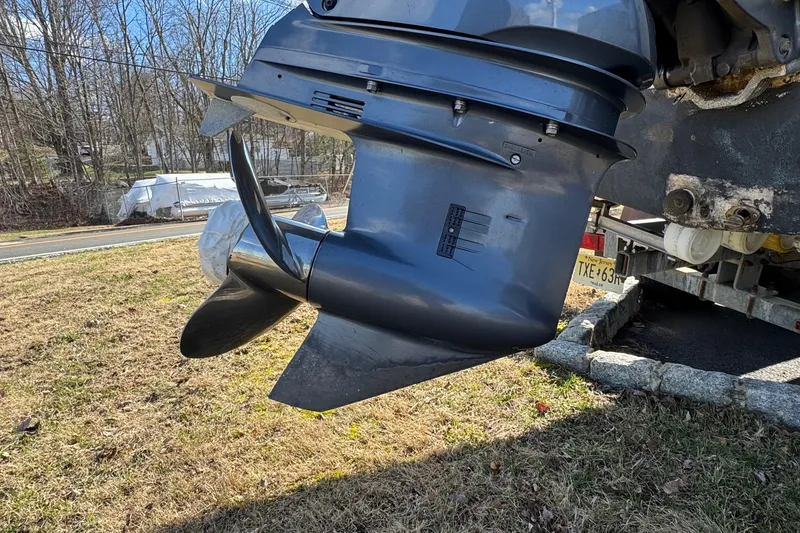 Slide: The Image of Outboard motor of a 2017 NauticStar 243DC Sport Deck on a trailer. - 25