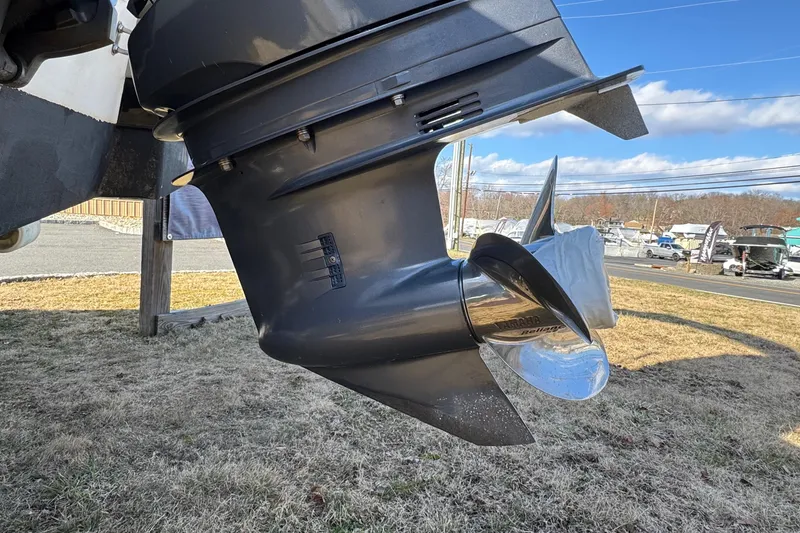 Slide: The Image of Close-up of a 2017 NauticStar 243DC Sport Deck boat propeller on dry land. - 26